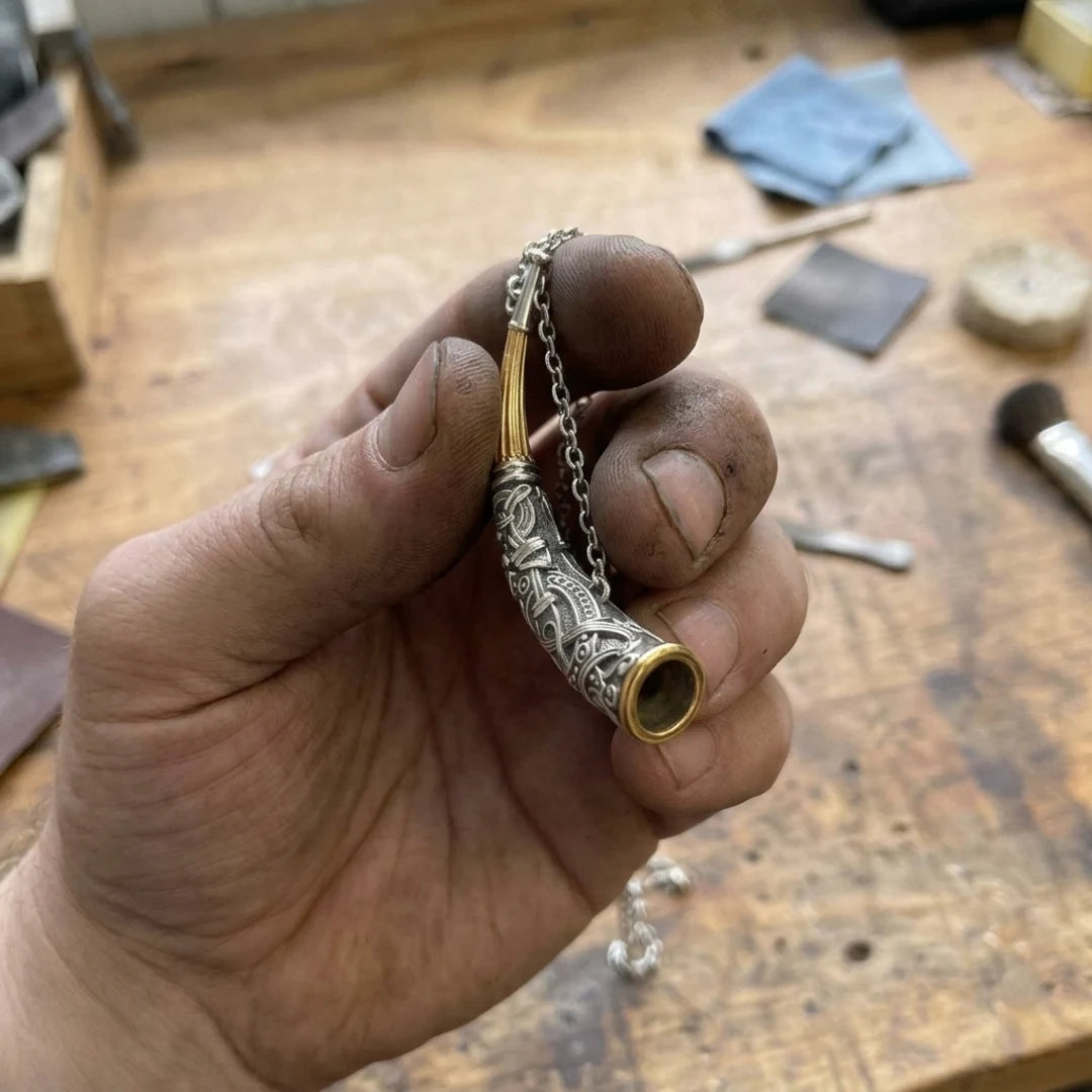 Gjallarhorn Heirloom Norsk Horn Pendant - pendant held in the maker's hand