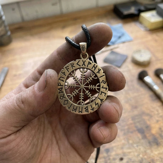 Helm Of Awe Runes Pendant held in the maker's hand