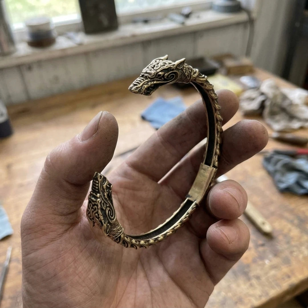 Wolf Oath Fenrir Arm Ring - Wolf oath fenrir arm ring held in the maker's hand
