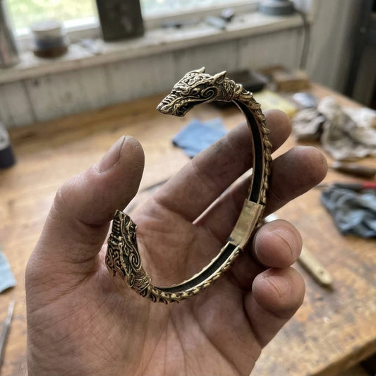 Wolf Oath Fenrir Arm Ring - Wolf oath fenrir arm ring held in the maker's hand